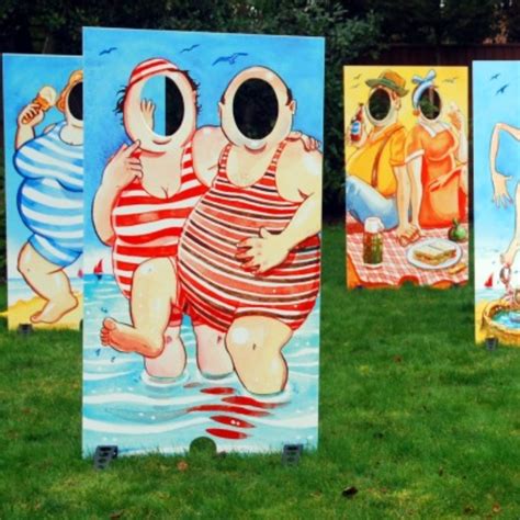 cardboard cutouts with face hole.